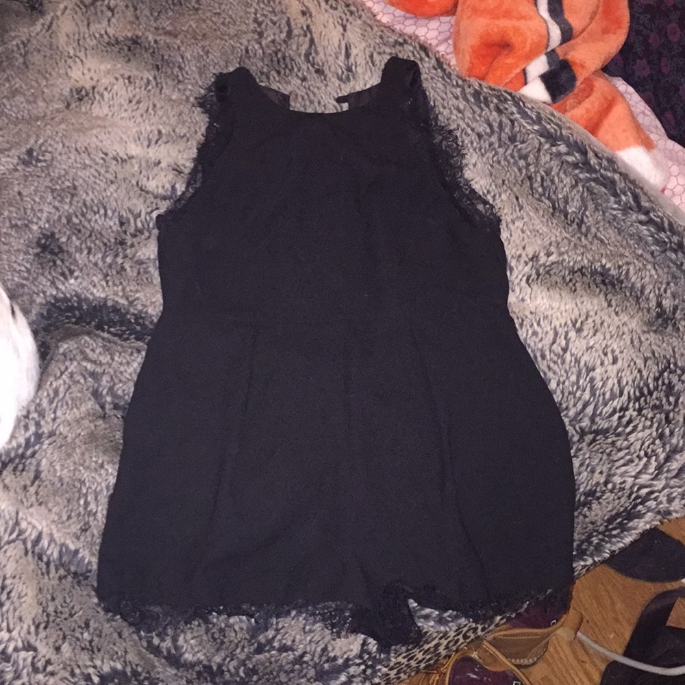 Adorable black romper with lace accents